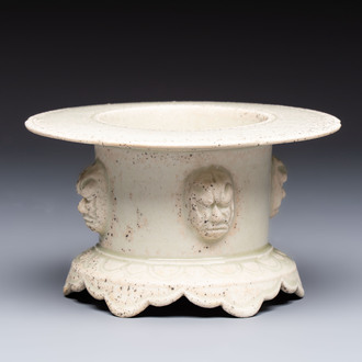 A Chinese qingbai censer with masks in relief, 20th C