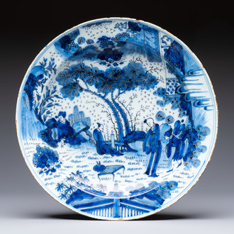 A large manganese, blue and white Dutch Delft chinoiserie dish, 17th C.