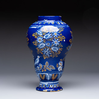 A Nevers blue-ground baluster vase with birds among flowering branches, France, 2nd half 17th C.