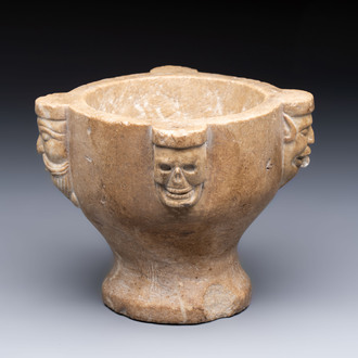 A rare Italian marble ‘poison mortar’ with skulls and masks, 17th C.