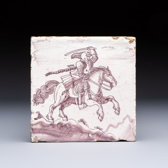 A very unusual manganese Dutch Delft 'Knight on Horseback in Open Air' tile, late 17th C.