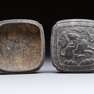A Chinese carved black pottery 'Mythical Animal' box and cover, Yuan/Ming