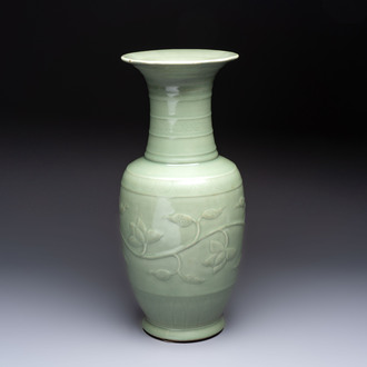 A Chinese celadon-glazed vase with relief lotus scroll design, 18th C.