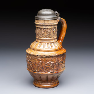 A Raeren stoneware 'Peasants Dance' jug with a mounted pewter lid, dated 1587