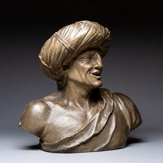 A large patinated terracotta bust of a smiling Oriental man, 18/19th C.