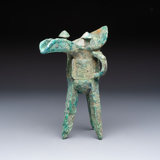 A Chinese archaic bronze wine vessel with Taotie design, Jue 爵, late Shang