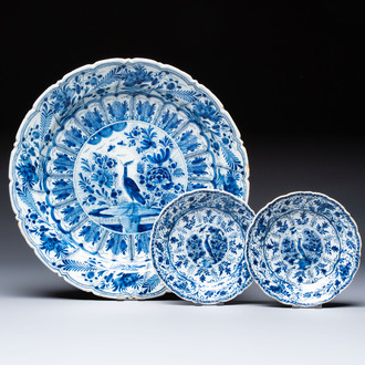 A pair of blue and white Dutch Delft 'Cranes' plates and a dish, 18th C.