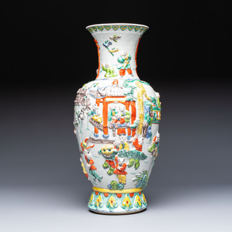 A Chinese famille verte '100 Boys' vase with relief design, 20th C.