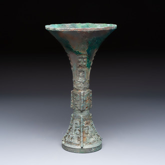 A Chinese archaic bronze wine vessel with Taotie design, Gu 觚, Shang