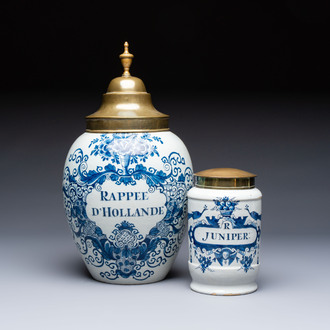 A blue and white Dutch Delft tobacco jar and a drug jar with brass lids, 18th C.