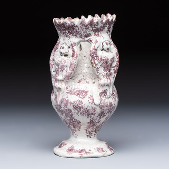 A continental manganese- and white-splashed pottery money bank, 18/19th C.