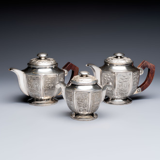 Two Vietnamese silver teapots and a covered sugar bowl, marked Donghung, ca. 1900