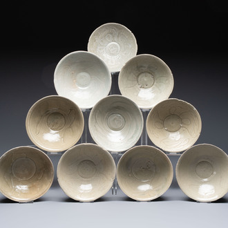 A group of ten Chinese celadon-glazed bowls with incised floral design from the Jepara shipwreck, Fujian kilns, Song