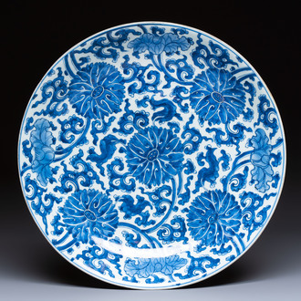 A large Chinese blue and white 'Lotus Scroll' dish, Kangxi