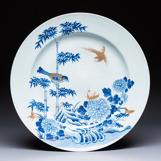 A large Chinese blue and white gilt-decorated dish with birds and insects among bamboo and peonies, Yongzheng