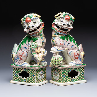 A pair of Chinese verte biscuit models of Buddhist lions, 18th C.