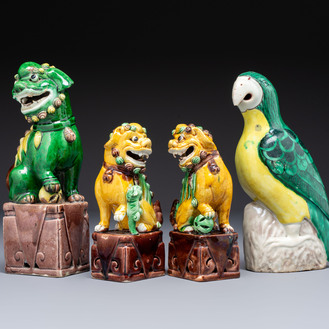 Three Chinese sancai-glazed Buddhist lions and a parrot, 19th C.