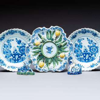 Two polychrome Dutch Delft miniature models of animals, a 'Pineapple' stand and a pair of blue and white plates, 18th C.
