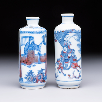 Two Chinese blue, white and copper-red snuff bottles with narrative design, 19th C.