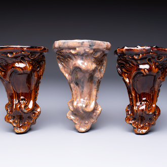 Three rare Bruges faience 'Faux Marble' and brown-glazed wall consoles, Pulinckx workshop, 18th C.
