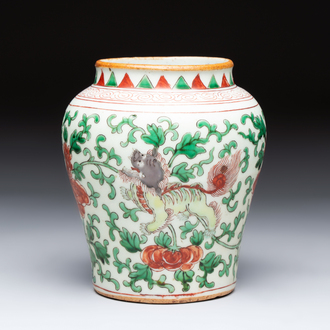 A small Chinese wucai 'Buddhist Lions and Peony Scrolls' jar, Transitional period