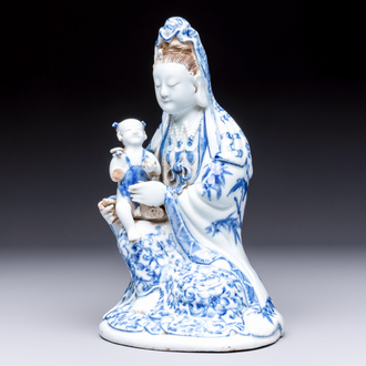 A Chinese blue and white 'Guanyin and child' group, Qianlong