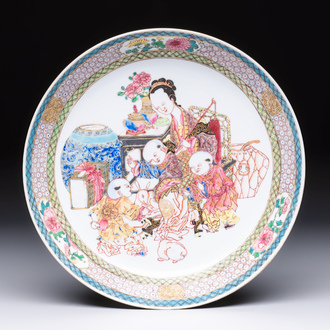 A fine Chinese famille rose eggshell plate with a lady and playing boys, Yongzheng
