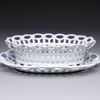 A rare white-glazed Brussels faience reticulated basket on stand, 18th C.