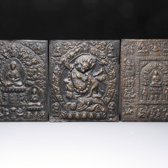 Three Tibetan copper repoussé plaques with Buddhist subjects, 19th C.