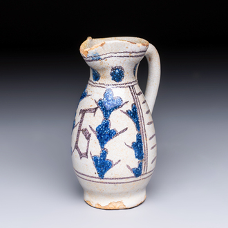 A rare intact early Italian maiolica ewer inscribed 'G', Montelupo, 15th C.