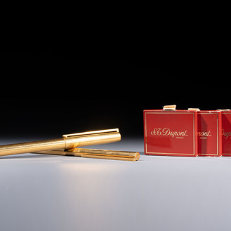 A gold-plated twist ballpoint pen and a fountain pen with an 18kt gold nib, S.T. Dupont Paris, France, 20th C.