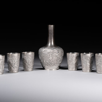 A Chinese Canton or Vietnamese silver bottle vase with landscape design and six cups, 19th C.