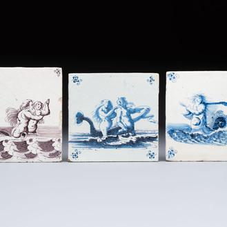 Two blue and white and one manganese Dutch Delft tiles with sea creatures, 17th C.