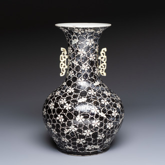 A rare Chinese famille noire 'Prunus on Cracked Ice' vase with 'Chilong' handles, 19th C.