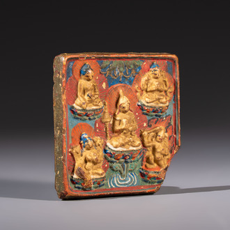 A gilt polychrome stucco votive plaque, Tsha Tsha, Tibet, 18/19th C.