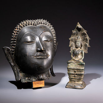 A Cambodian bronze Buddha and a Thai Buddha head, 19th C.