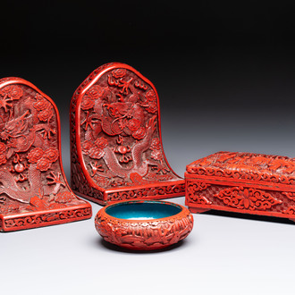 A pair of Chinese cinnabar lacquer bookends, a covered box and a brush washer, 19/20th C.