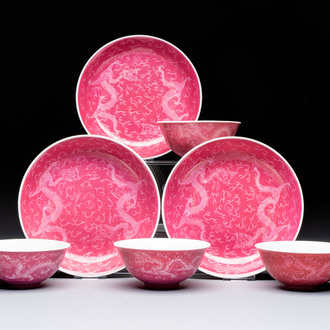Four Chinese sgraffito ruby-ground 'Dragon' cups and three plates, Qianlong mark, Republic