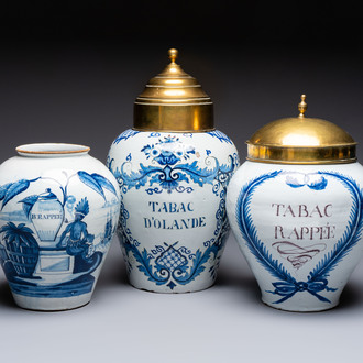 A blue and white Dutch Delft tobacco jar and two French tobacco jars with brass lids, 18/19th C.