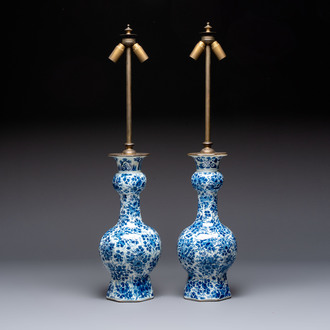 A pair of blue and white Dutch Delft garlic-head vases mounted as lamps, 18th C.