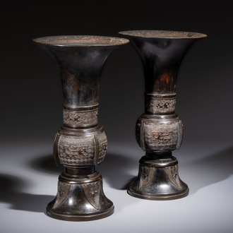 A pair of Chinese archaistic bronze 'Gu' vases, 18th C.