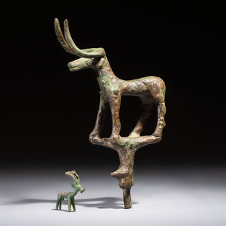 An Anatolian copper-alloy standard surmounted by a long-horned bull and a Luristan deer, 1st millennium BC.