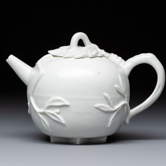 A Chinese Dehua blanc de Chine 'Pomegranate' teapot and cover, Kangxi