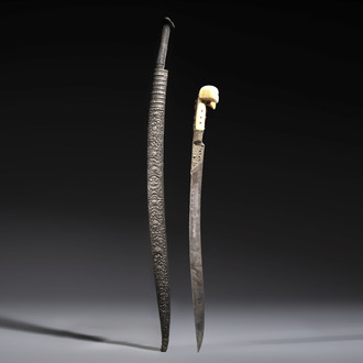 Two Ottoman yatagan swords, one with a silver scabbard, Turkey, 19th C.