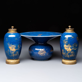 A Chinese powder-blue-ground gilt-decorated spittoon and two gilt-bronze-mounted vases, 18th C.