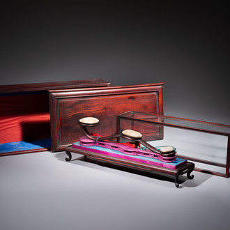 A Chinese white-jade-inset hongmu ruyi with a wooden presentation box and display case, 19th C.