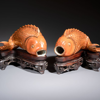 A pair of Chinese coral-red-glazed gilt-decorated 'Goldfish' wall pocket vases on wooden stands, Republic