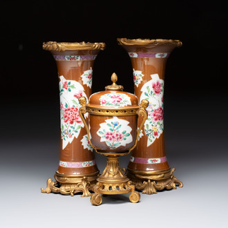 A pair of gilt-bronze-mounted Chinese famille rose capucine-ground vases and a covered bowl, Qianlong