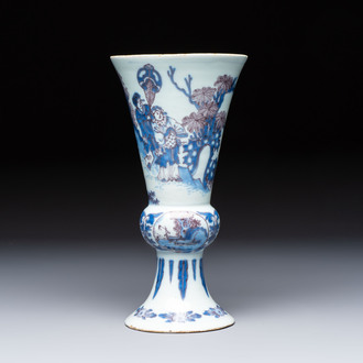An extremely rare blue, white and manganese Dutch Delft chinoiserie beaker vase after a silver model, late 17th C.