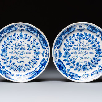 A pair of blue and white Delftware 'Proverb' plates, Germany, dated 1720